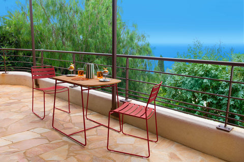 Mesa de teca SURPRISING de acero y teca de la marca Fermob. comprar online en ricon del mueble