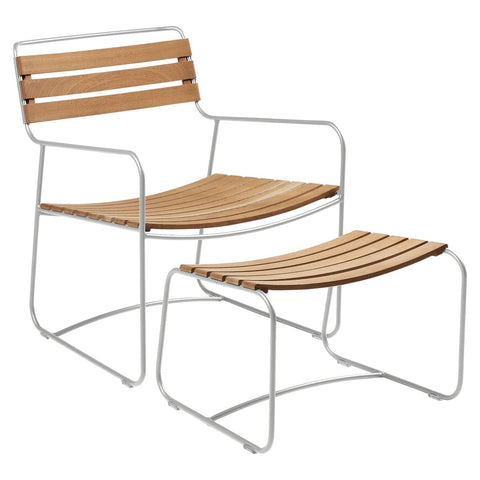 Conjunto de sillón bajo con reposabrazos y reposapiés de teca SURPRISING de la marca francesa Fermob. Comprar Fermob online. Rincón del Mueble
